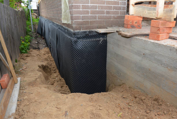 Happy homeowners after waterproofing job in Monroeville
